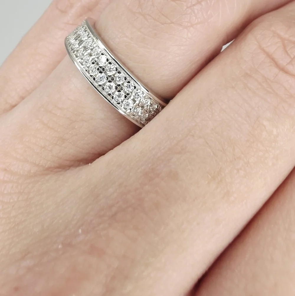 This is a 2 Row Moissanite Diamonds Band . S925 Silver. vvs1 D. size 7